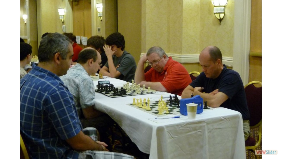 New York State Championship, Albany NY, 2009. GM Giorgi Kacheishvili vs FM Igor Nikolayev. GM Joel Benjamin and IM Jay Bonin on board 2.