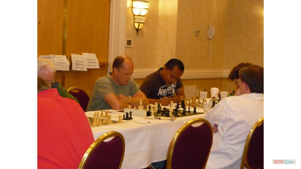New York State Championship, Albany NY, 2011. FM Igor Nikolayev vs NM Steven Taylor. GM Mark Paragua vs IM Mark Esserman on the right.